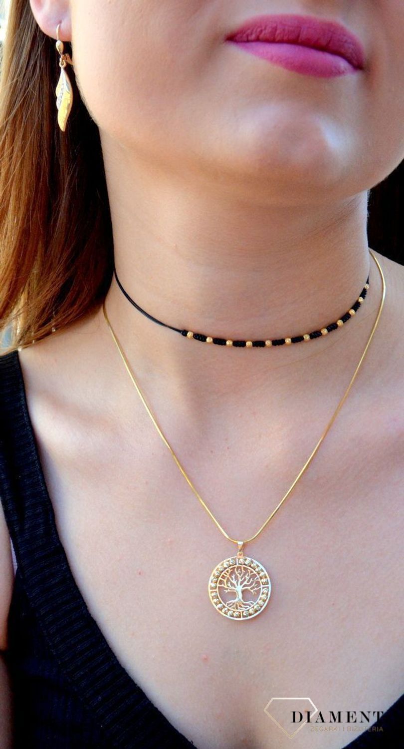 Złota zawieszka pr 333 drzewko szczęścia ZA 6331 333. Złota zawieszka w kształcie drzewka na szczęście ozdobiona grawerowanymi kuleczkami. Elegancki wisiorek wykonany z próby 333 żółtego złota. Ta unikalna biżuteria, która zachwyci każd.jpg